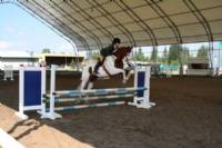 2009 APHA Zone 10 show.  Caitlin Smith riding Blue Eyed Storm over the jumps